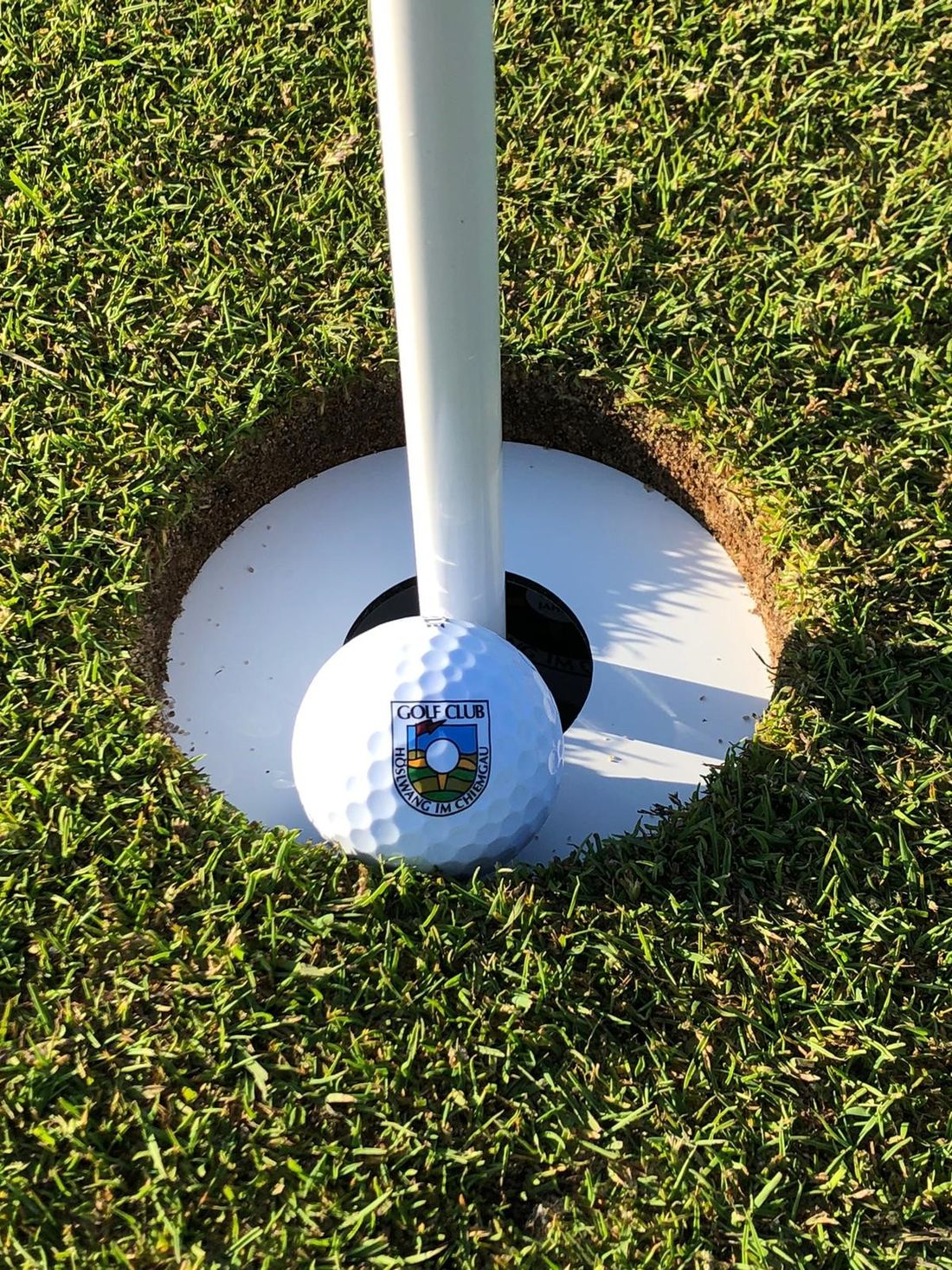 Golfball und Schläger